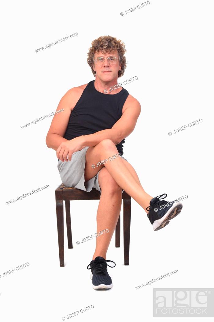 Stock Photo: front view of a man sitting on white background, .