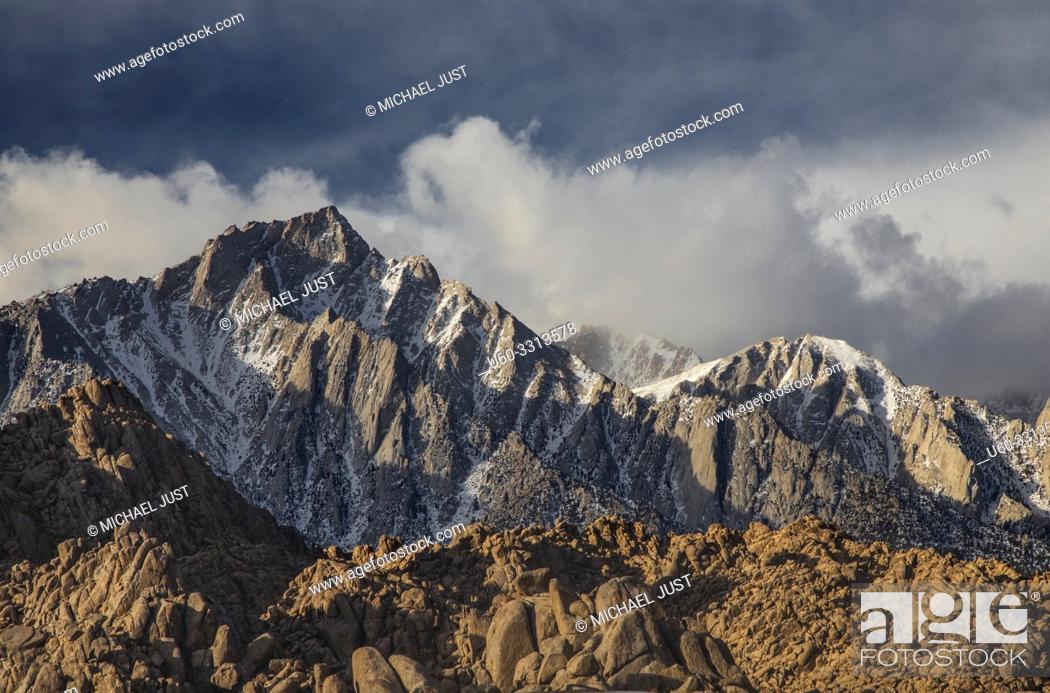 Stock Photo: The snow-covered Sierra Nevada Mounatins standout from the Alabama Hills at Lone Pine, California.