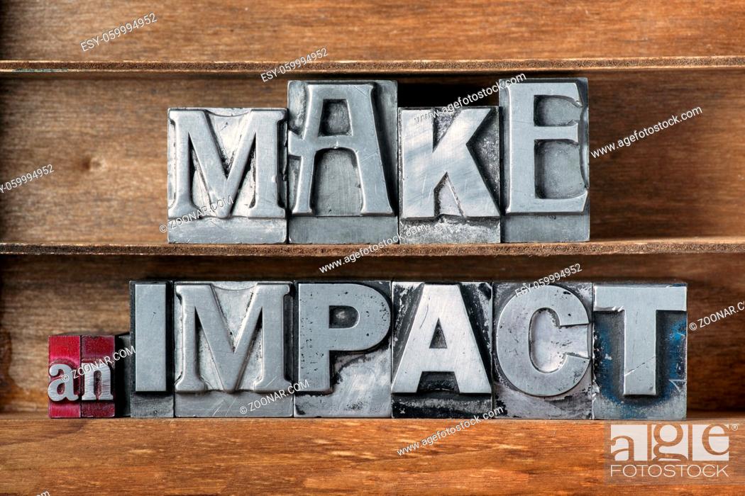 Stock Photo: make an impact phrase made from metallic letterpress type on wooden tray.