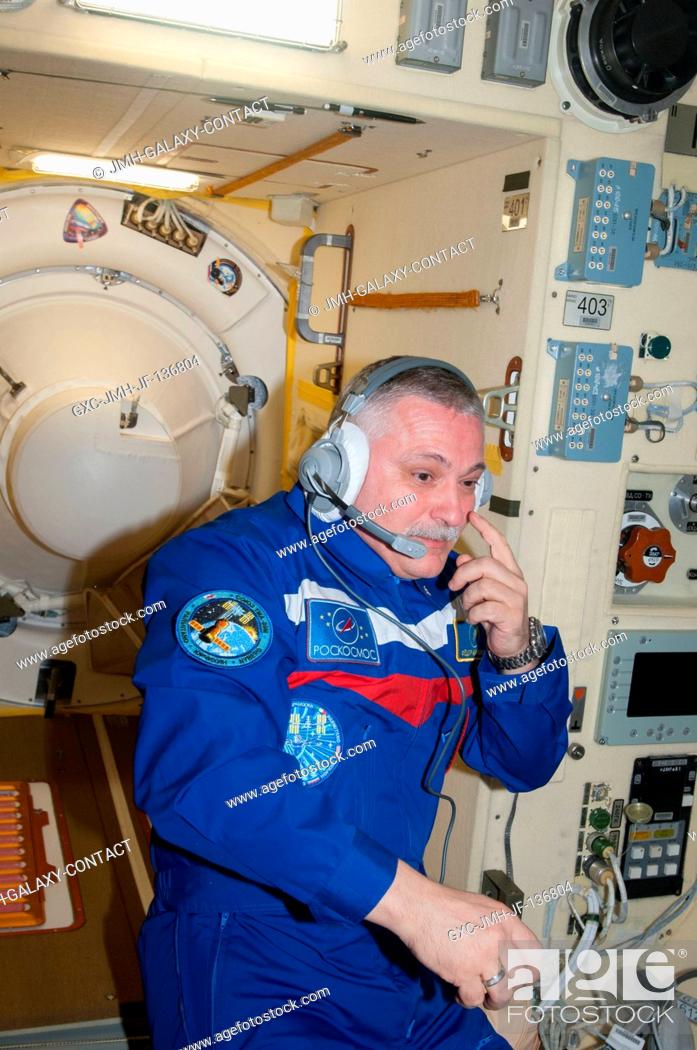 Stock Photo: Russian cosmonaut Fyodor Yurchikhin, Expedition 37 commander, wearing a communication headset, is pictured in the Poisk Mini-Research Module 2 (MRM2) of the.