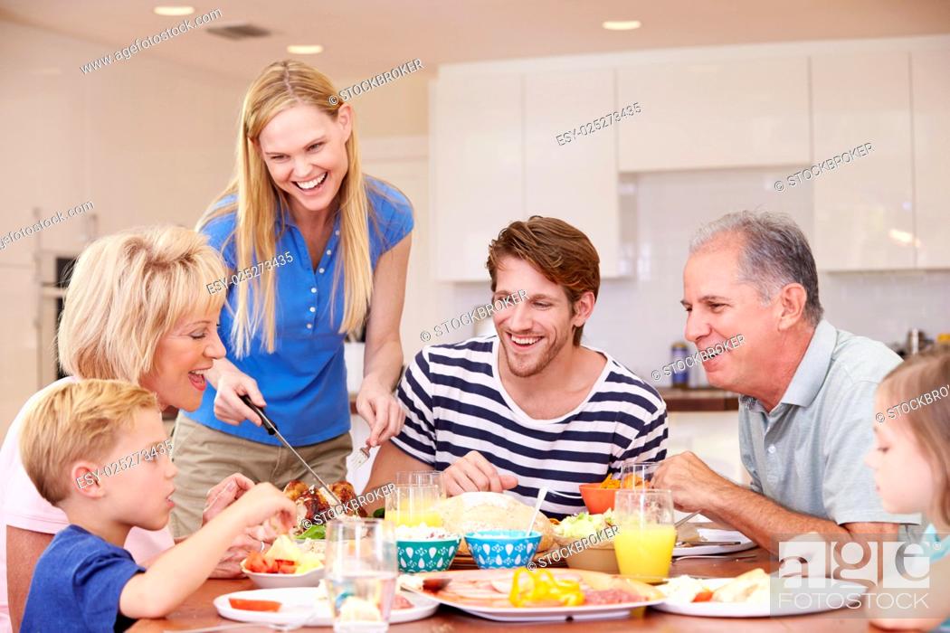 Stock Photo: Multi Generation Family Enjoying Meal At Home Together.