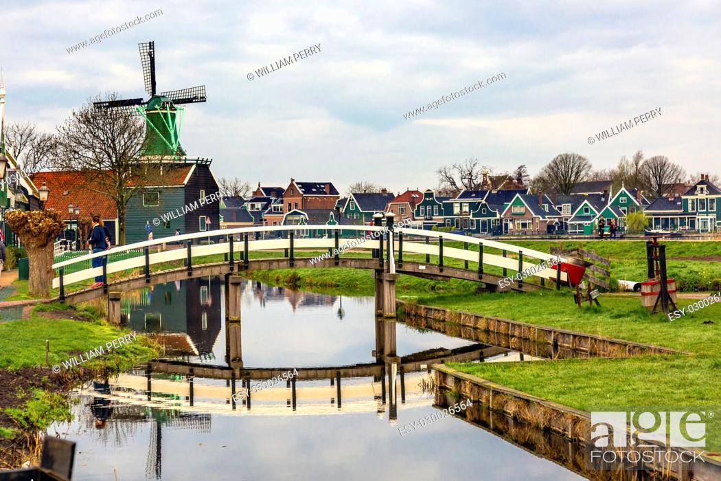 Stock Photo: Wooden Windmill White Bridge Reflection Zaanse Schans Old Windmill Village Countryside Holland Netherlands. Working windmills from the 16th to 18th century on.