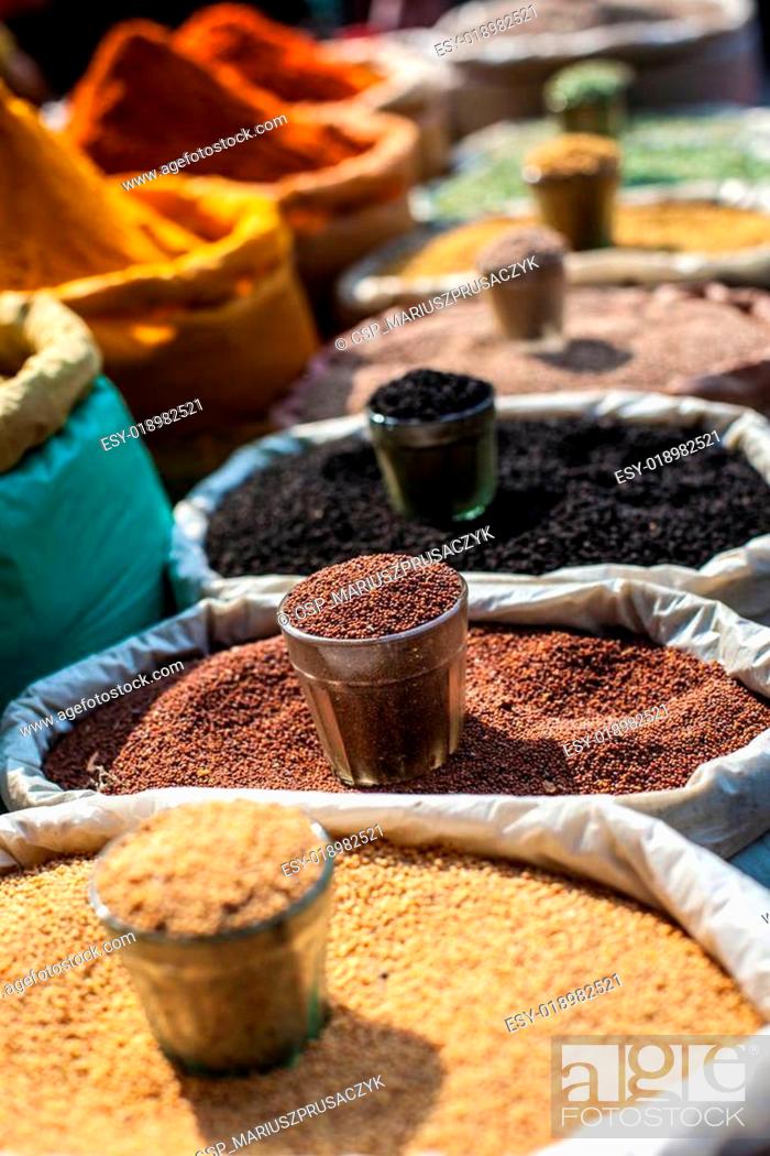 Stock Photo: Indian colored spices at local market.