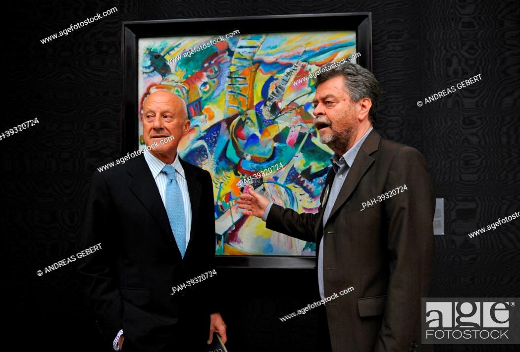 Stock Photo: Director of the Lenbachhaus Helmut Friedel (R) talks with Architect Sir Norman Foster during the re-opening ceremony for the renovated Lenbachhaus in Munich.