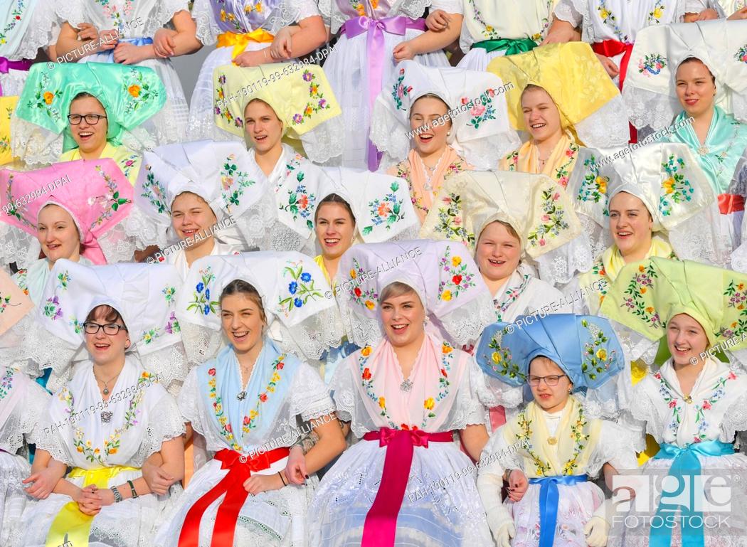 Stock Photo: 19 January 2019, Brandenburg, Burg: Young women and girls in original Sorbian-Wendish festive costumes have set themselves up for a group photo at the.
