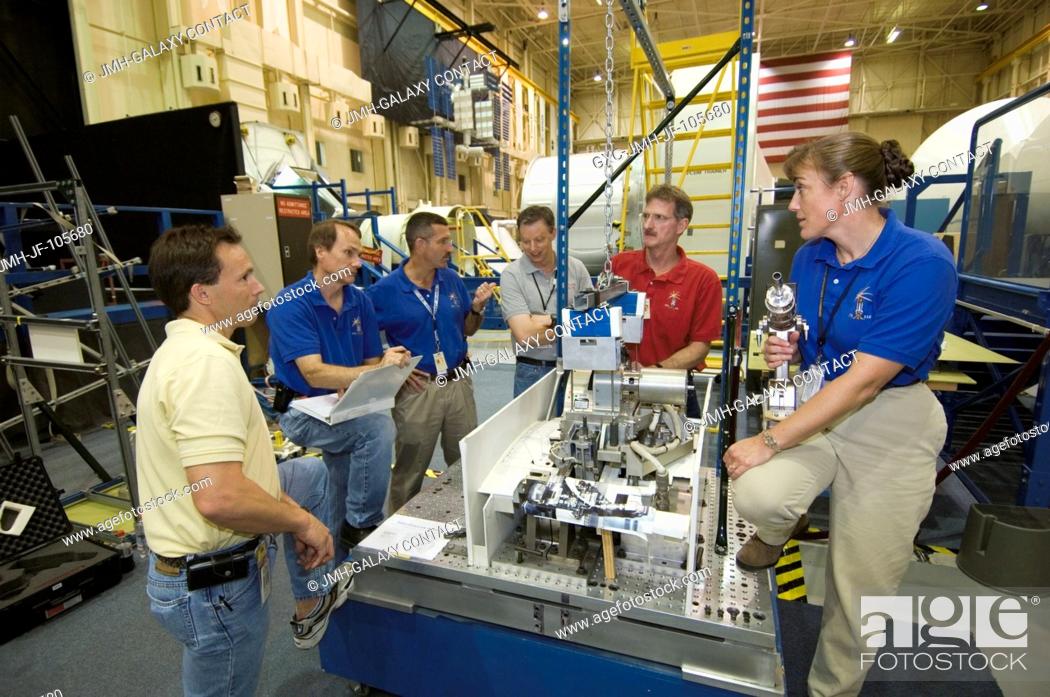 Stock Photo: Astronauts Heidemarie M. Stefanyshyn-Piper (right), Joseph R. Tanner (background), Daniel C. Burbank, and Steven G. MacLean representing the Canadian Space.