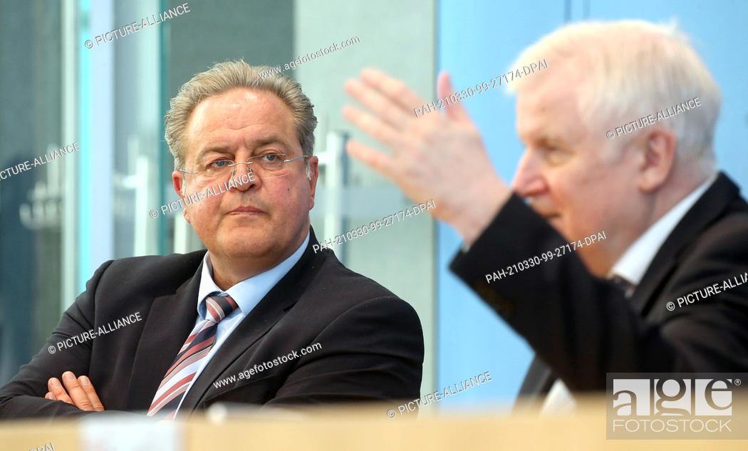 Stock Photo: 30 March 2021, Berlin: Horst Seehofer (CSU), Federal Minister of the Interior, for Construction and Home Affairs, and Dieter Romann (l).