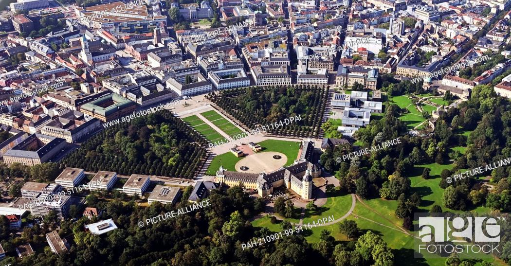 Stock Photo: 01 September 2021, Baden-Wuerttemberg, Karlsruhe: Aerial view (taken from an airplane) of downtown Karlsruhe. Because the streets run like rays from the castle.
