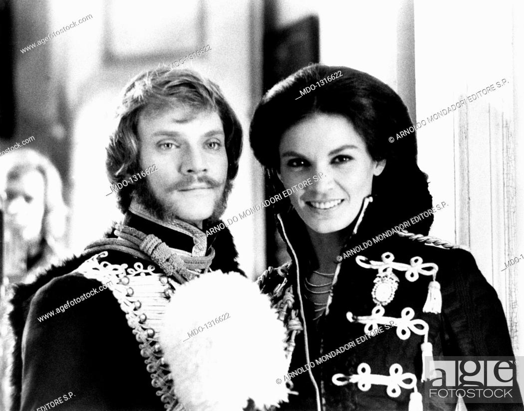 Stock Photo: Malcolm McDowell and Florinda Bolkan. Malcolm McDowelll together with Florinda Bolkan smiling on the set of the film 'Royal Flash'.