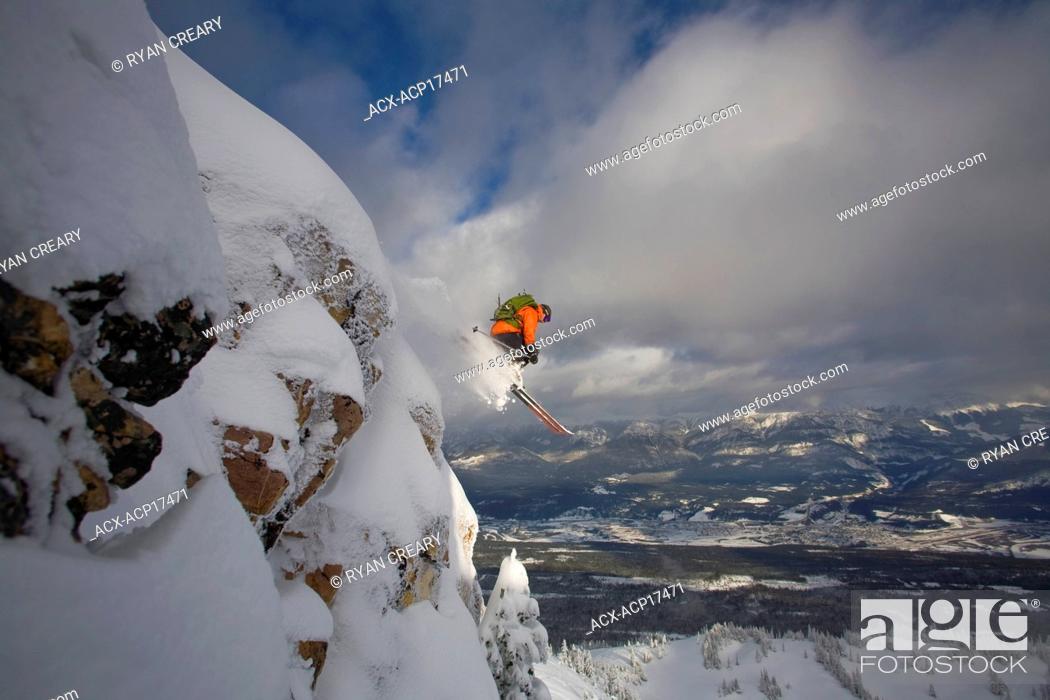 Stock Photo: A skier catching big air in the backcountry of Kicking Horse, Golden, British Columbia, Canada.