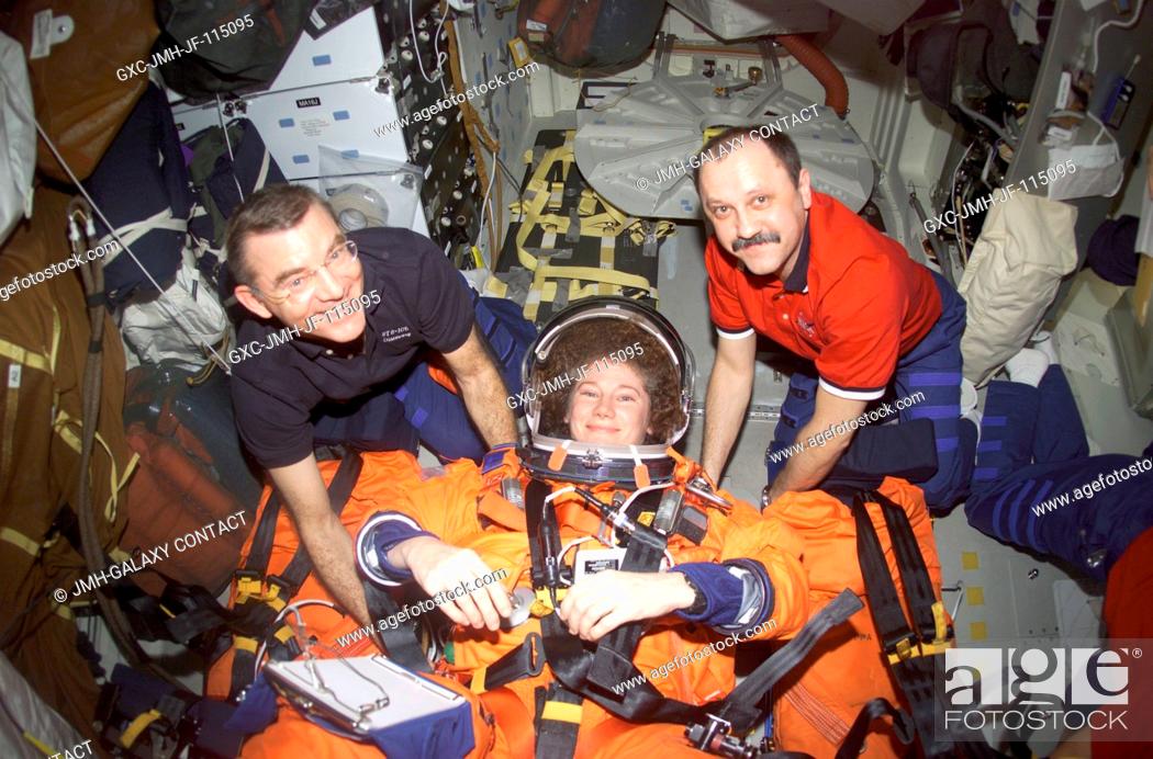 Stock Photo: As they near completion of their mission, the Expedition Two crew members prepare for the descent back to Earth. Astronaut James S.