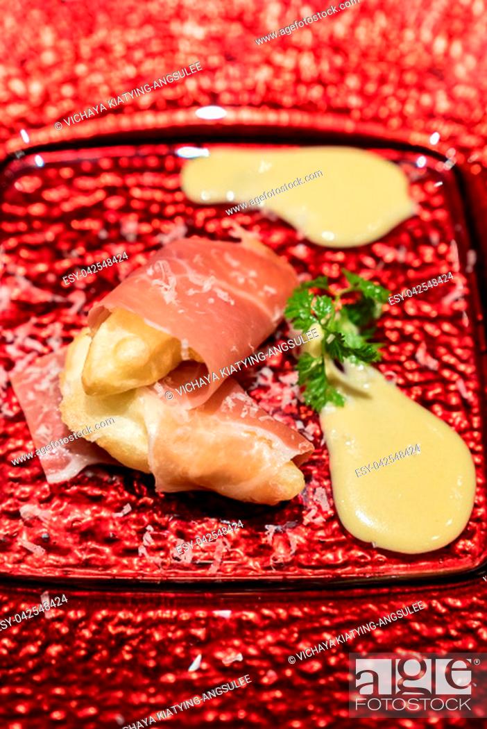 Stock Photo: Arranged small ball : Deep fried European pear tempura with Prosciutto parma ham.