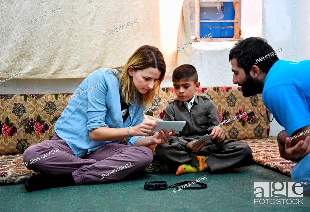 Stock Photo: EXCLUSIVE - UNICEF ambassador Eva Padberg visits the family of nine-year-old Murat (C) in a refugee camp for Syrian refugees in the Dohuk region, Iraq.