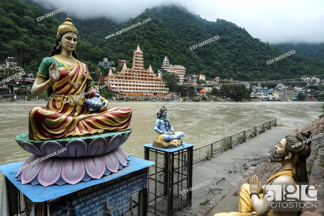 Stock Photo: Rishikesh, India - July 2021: Views of the Swarg Niwas Temple from the Sai Ghat in Rishikesh on July 20, 2021 in Uttarakhand, India.