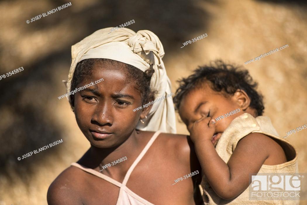 Stock Photo: Malagasy mother of ethnic Sakalava with her son. Morondava, Madagascar.