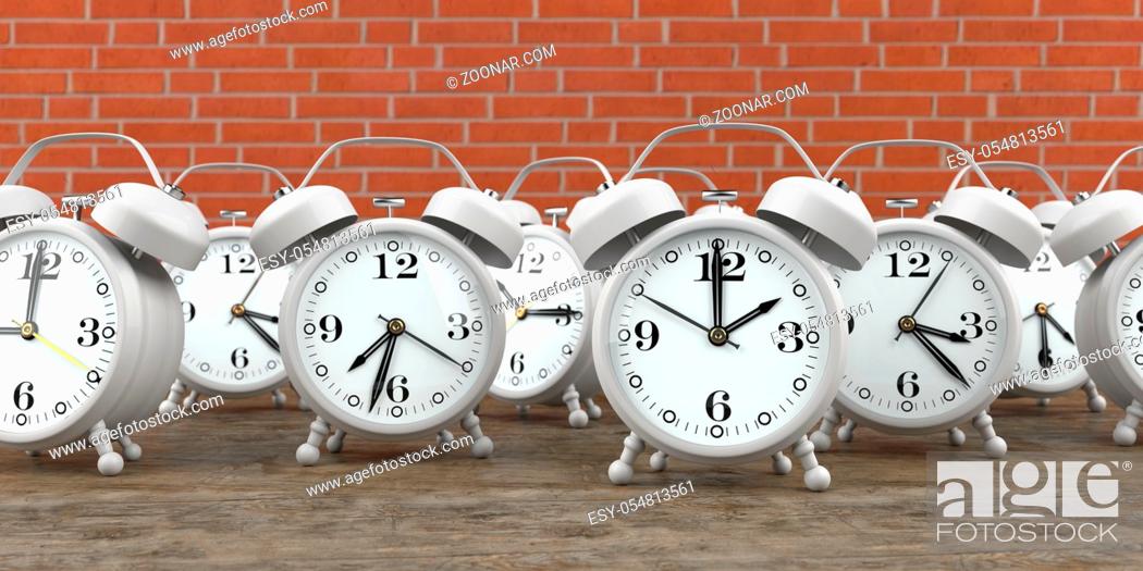 Stock Photo: White alarmers on the wooden background. 3d illustration.