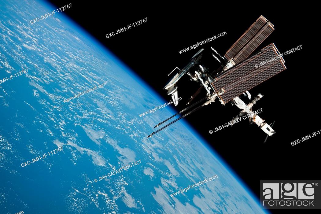 Stock Photo: This image of the International Space Station and the docked space shuttle Endeavour, flying at an altitude of approximately 220 miles.