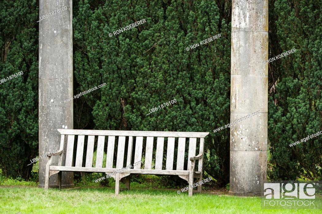 Stock Photo: A wooden bench between two pillars. Filoli, Woodside, California  USA.