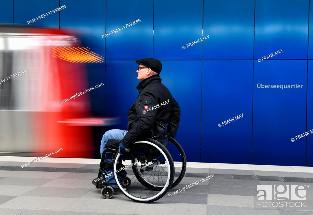 Stock Photo: A Wheelchair user at an underground station, Germany, city of Hamburg, 05. March 2019. Photo: Frank May (model released) | usage worldwide.