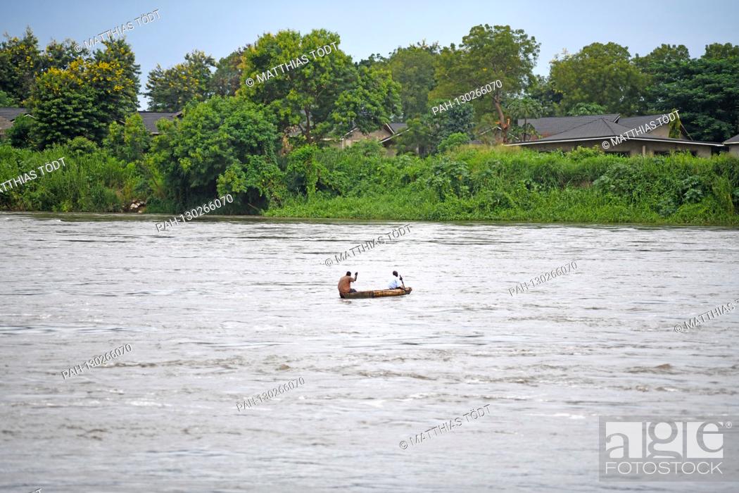 Stock Photo: Two men in a dugout on the White Nile near the South Sudanese capital of Juba, taken on 28.07.2019. The Nile in its total length of approx.