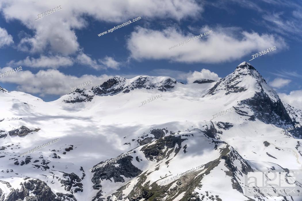 Stock Photo: aerial shot, from a sailplane, of late spring snow on nothern side of Scalino peak, shot in Alps in bright late springtime light, Sondrio, Lombardy, Italy.