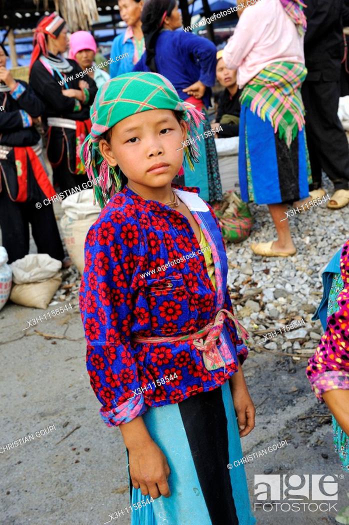 Stock Photo: H'mong little girl at the market of Yen Minh, Ha Giang province, Northern Vietnam, southeast asia.