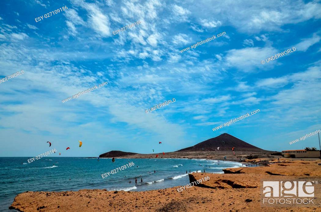 Stock Photo: Sunset on the Atlantic Ocean with a Mountain in Background El Medano Tenerife Canary Islands Spain.