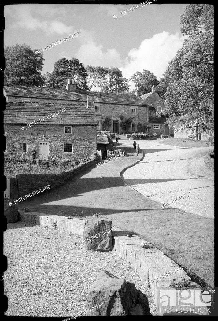 Stock Photo: A general view of Blanchland, looking north from the centre of the village, west of the abbey walls, towards Abbey Cottage and North Hill Cottages.