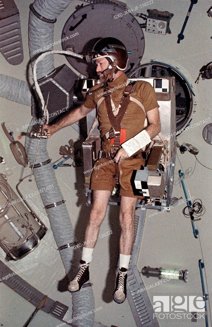 Stock Photo: Astronaut Gerald P. Carr, commander of the Skylab 4 mission, flies the Astronaut Maneuvering Equipment M509 Experiment in the forward compartment of the Orbital.