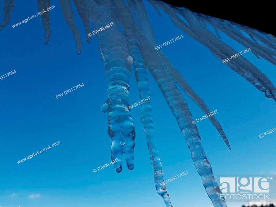 Stock Photo: ice stalactites in ioannina city greece wind waves in winter season in front of lake pamvotis greece.