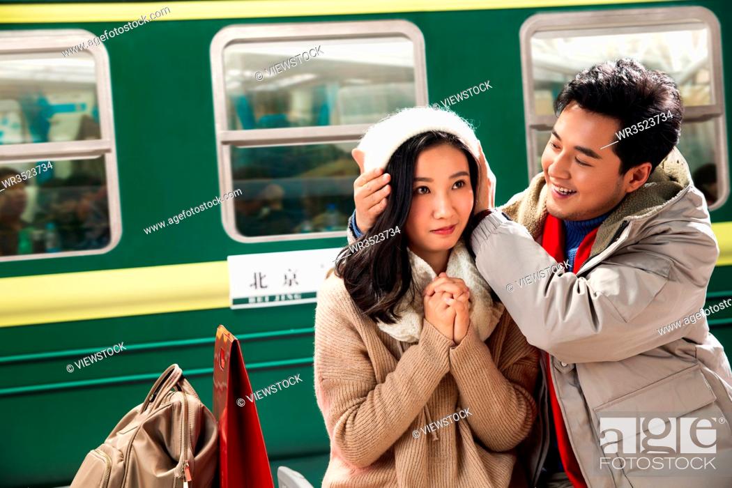 Stock Photo: The stage of young couples at the railway station.