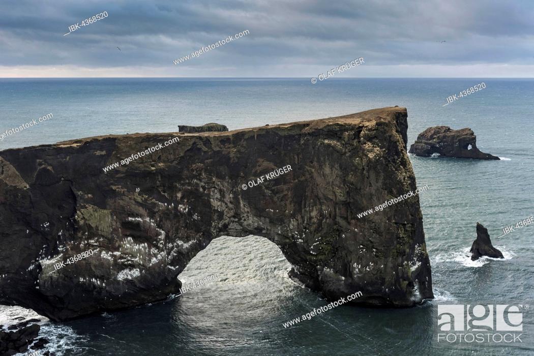 Stock Photo: Natural arch, Cape Dyrholaey, South Coast near Vik, Iceland.