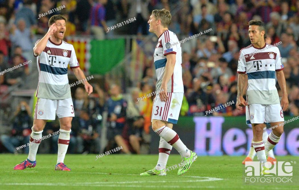 Stock Photo: Munich's Xabi Alonso (L-R), Bastian Schweinsteiger and Thiago Alcantara react after the UEFA Champions League semi-final first leg soccer match betweeen.