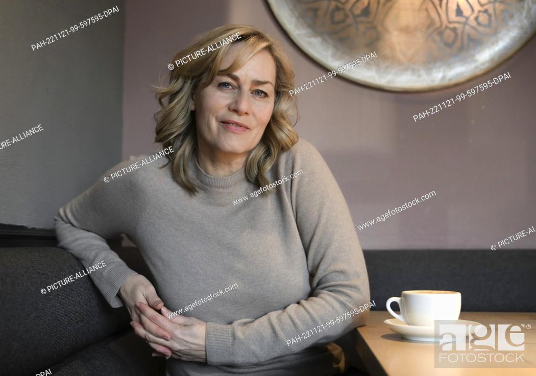 Stock Photo: PRODUCTION - 18 November 2022, Berlin: Actress Gesine Cukrowski sits at a photo shoot in a cafe. She is one of the most prominent German TV and film actresses.