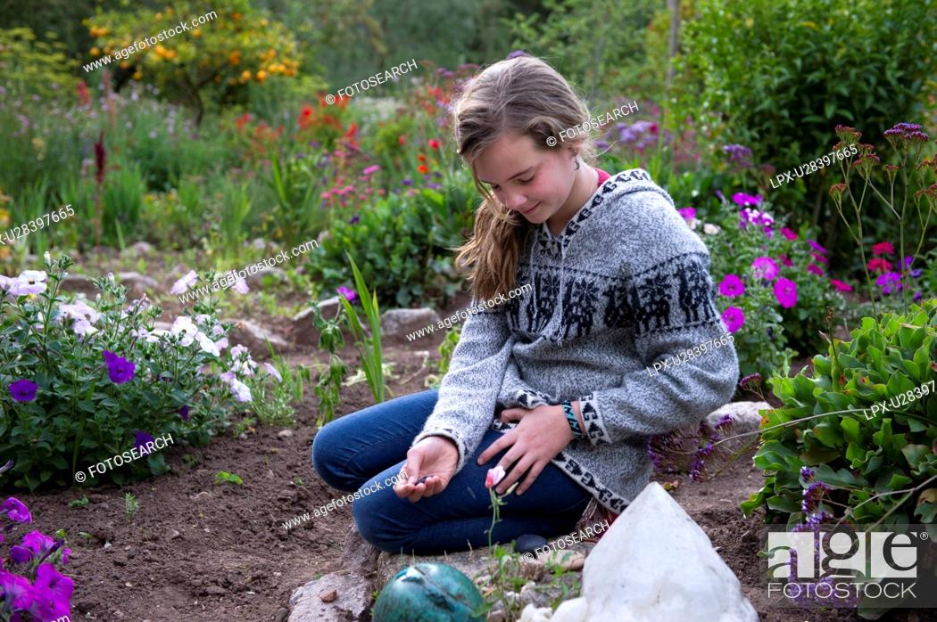 Stock Photo: Teenage girl in the garden of Willka Tika Guesthouse, Willka Tika, Sacred Valley, Cusco Region, Peru.