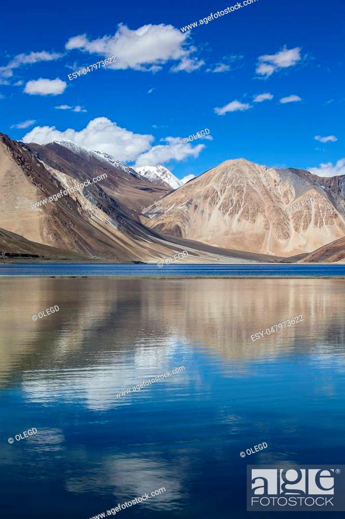 Stock Photo: Sunny day at Pangong Lake water and Himalayan mountain in India. Pangong Lake, is an endorheic lake in the Himalayas situated at a height of about 4.