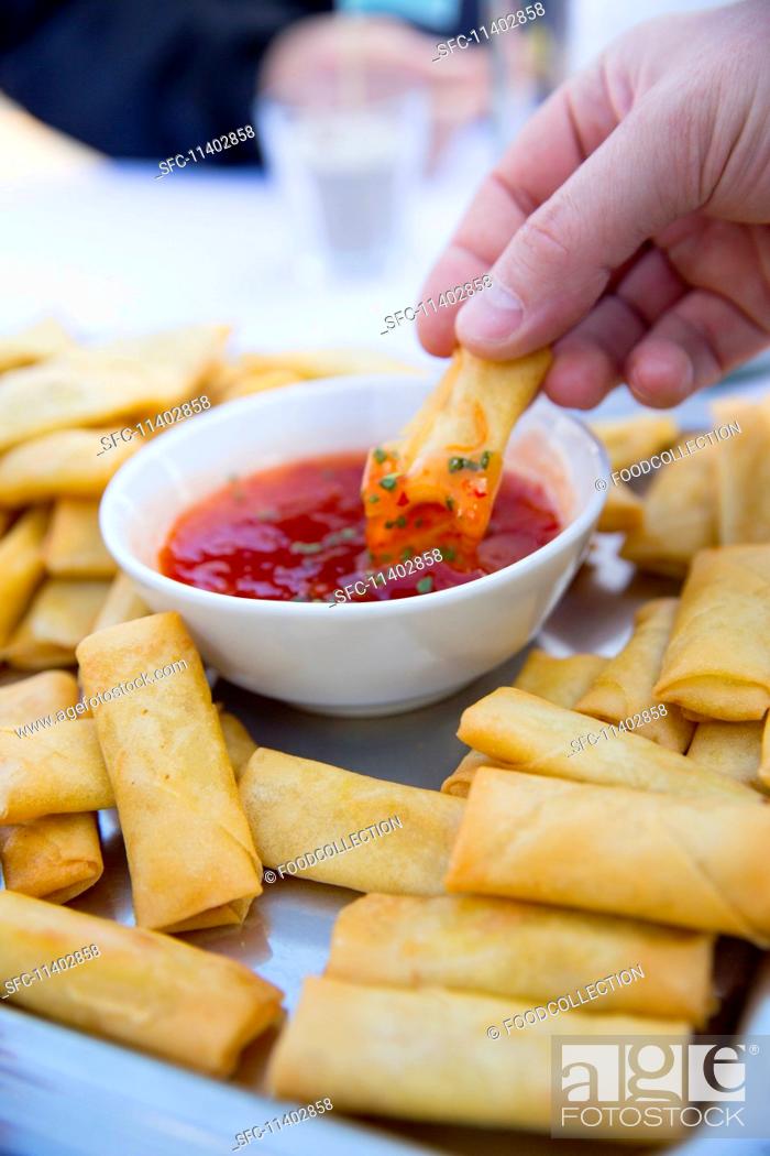 Stock Photo: Platter of Fried Spring Rolls with Dipping Sauce.