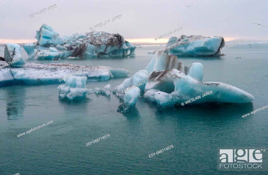 Stock Photo: Icebergs in Jokulsarlon beautiful glacial lagoon in Iceland. Jokulsarlon is a famous travel destination in Vatnajokull National Park, Iceland,.