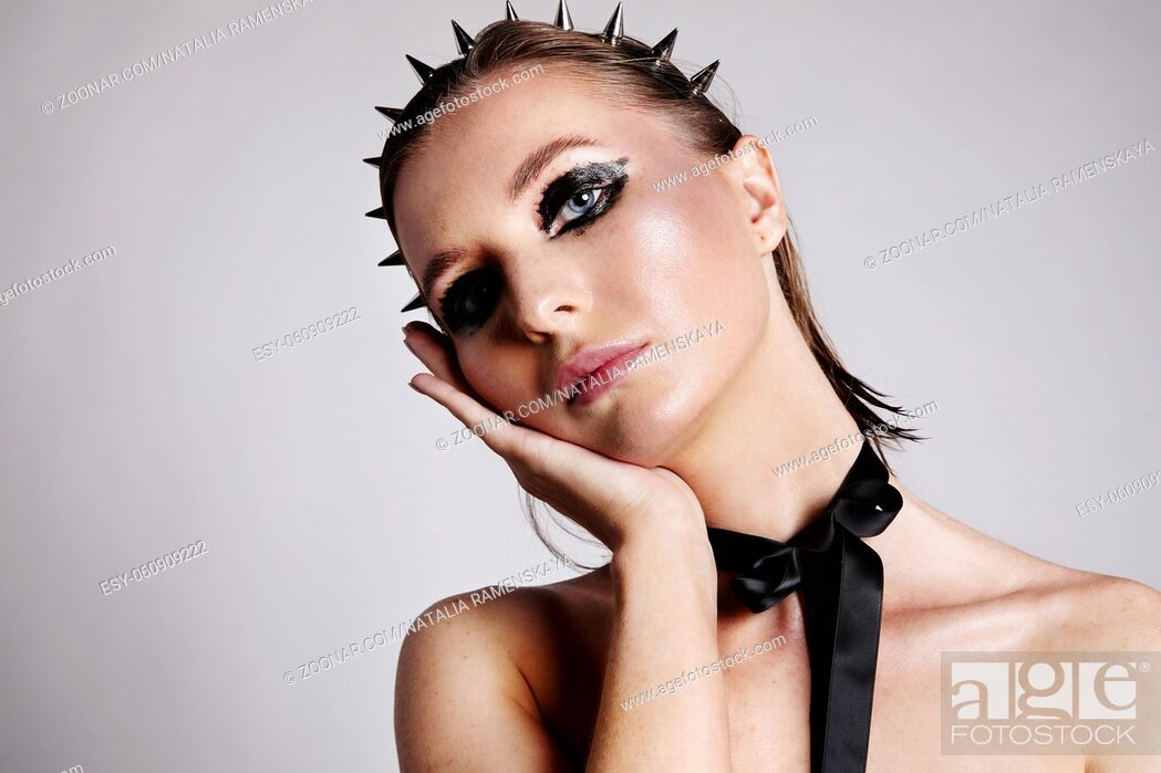 Stock Photo: Portrait of caucasian young woman with creative make-up. High quality photo.