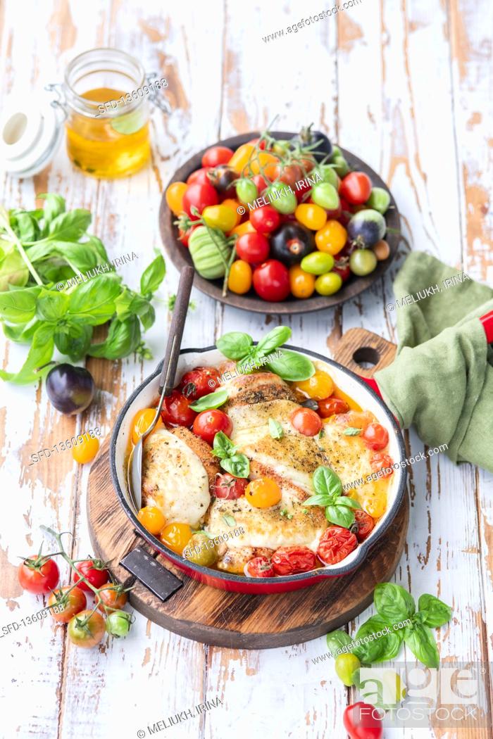 Stock Photo: Roasted chicken with tomatoes and mozzarella.
