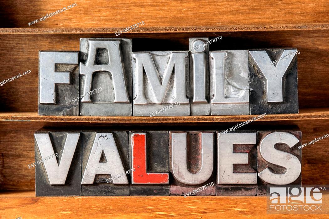 Stock Photo: family values phrase made from metallic letterpress type on wooden tray.