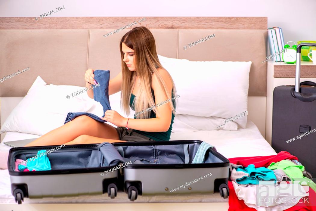 Stock Photo: Young woman getting ready for summer vacation.