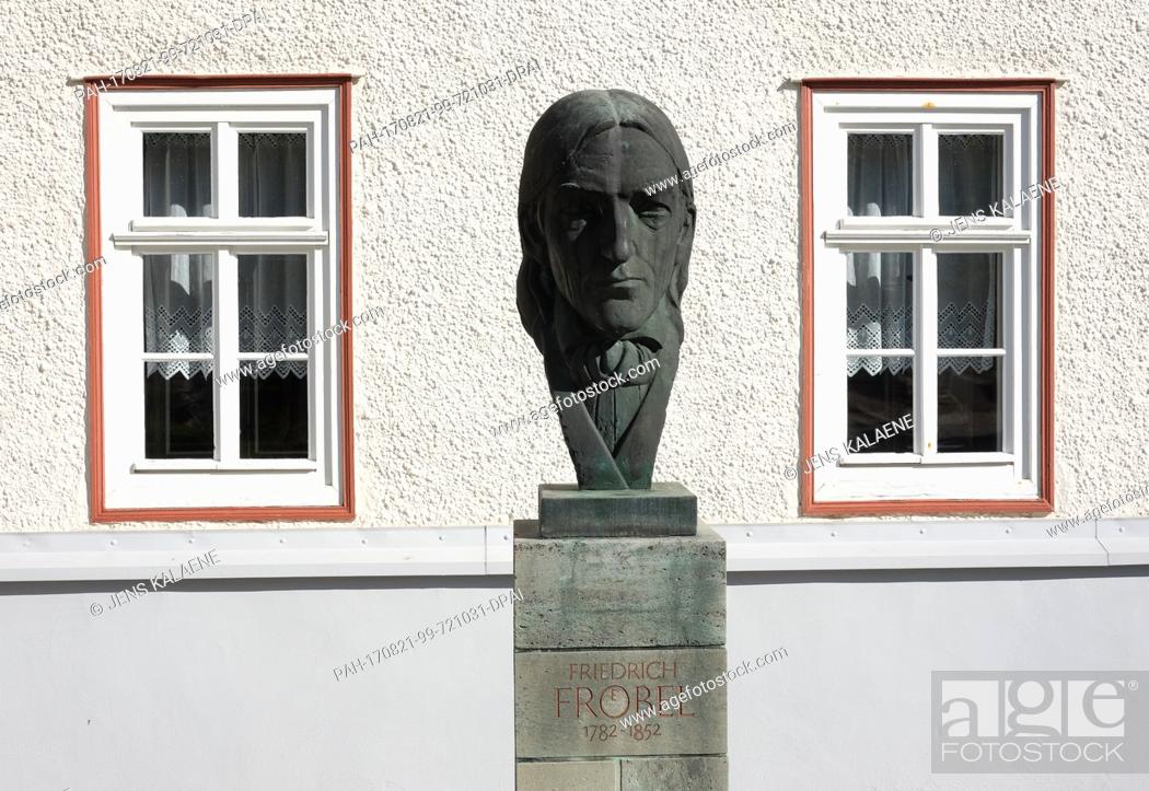 Stock Photo: A bust of Friedrich Froebel in front of his birth house in Obeweissbach, Germany, 19 August 2017. The house is now a museum.