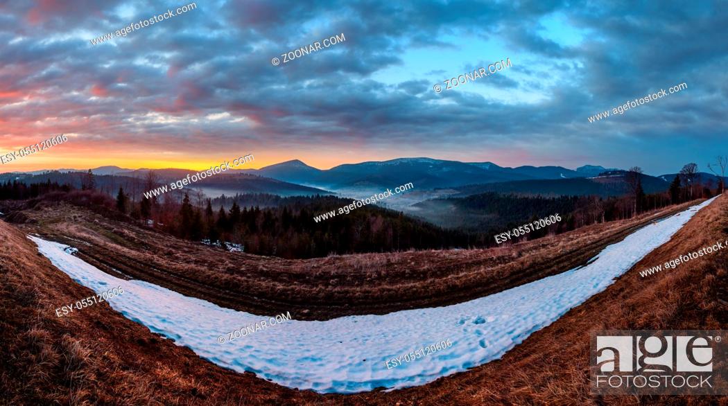 Stock Photo: Morning sunrise spring Carpathian mountains plateau landscape with snow-covered ridge tops in far, Ukraine.