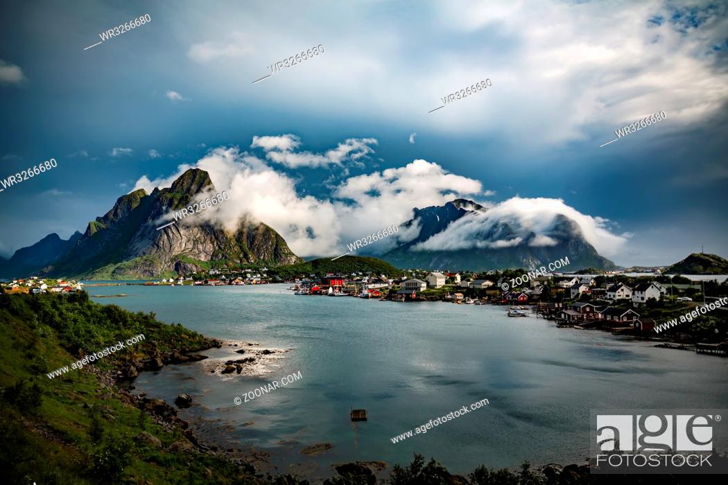 Stock Photo: Lofoten is an archipelago in the county of Nordland, Norway. Is known for a distinctive scenery with dramatic mountains and peaks, open sea and sheltered bays.