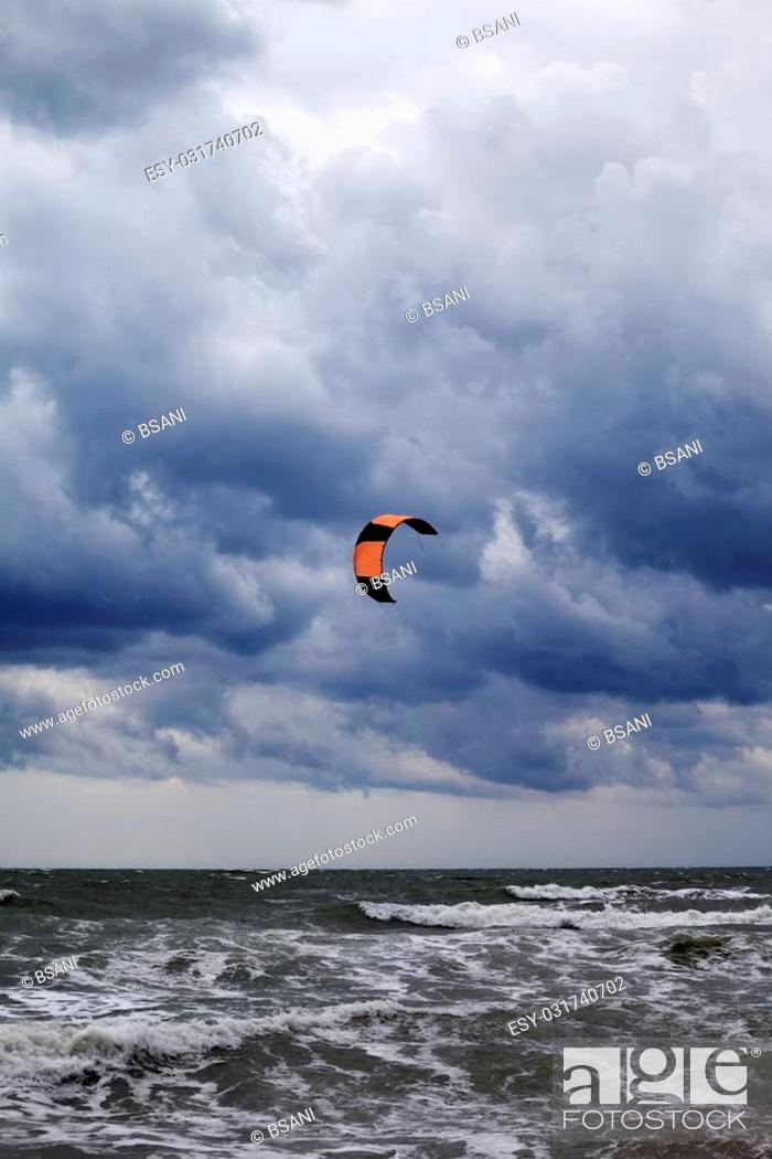 Stock Photo: Power kite in Black Sea and gray sky.
