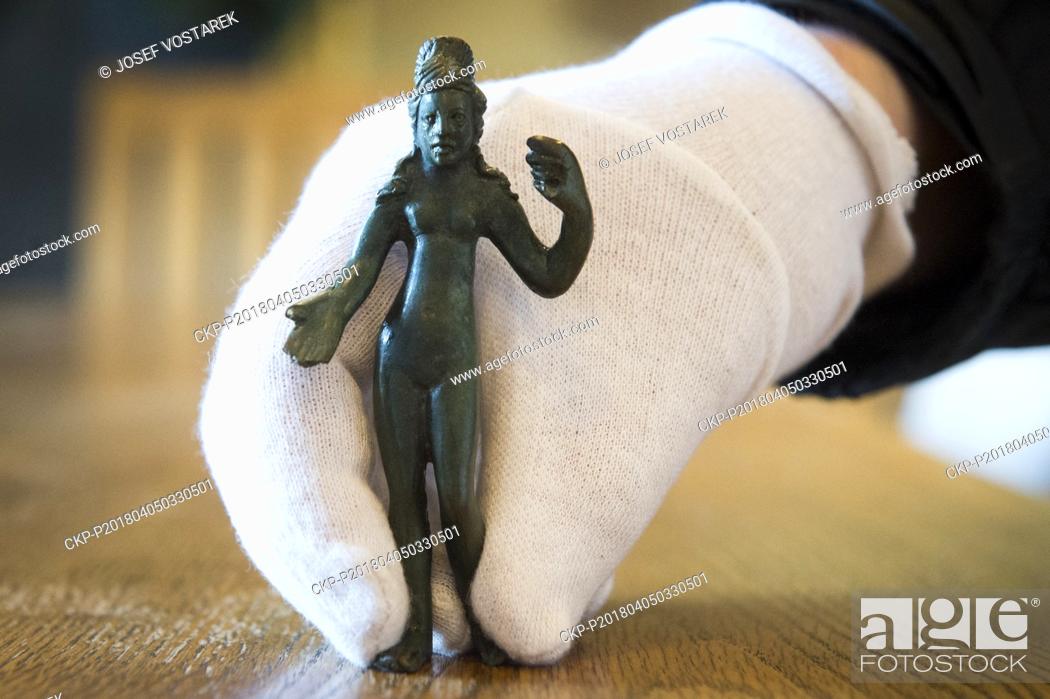Stock Photo: Archaeological find, 12 centimeters high bronze statuette of a ancient woman, is seen in Vysoke Myto, Czech Republic, on April 5, 2018.