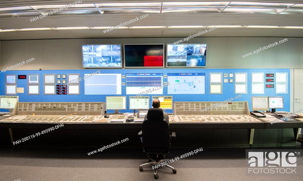 Stock Photo: 15 January 2020, Lower Saxony, Hohenhameln: An employee is sitting in the control room of the Mehrum coal-fired power plant in the district of Peine.