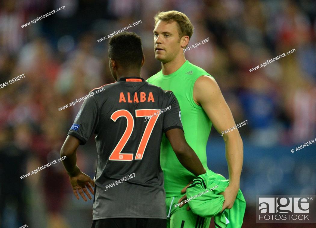 Stock Photo: Munich's David Alaba (l) and goalkeeper Manuel Neuer reacting after the Champions League Group D soccer match between Atletico Madrid and Bayern Munich at the.