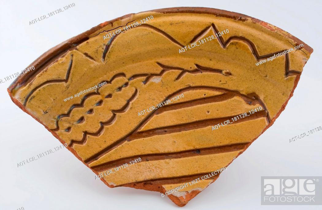 Stock Photo: Pottery dish on stand fins, dish with sgraffito and sludge decoration, dish plate crockery holder earth discovery ceramics earthenware glaze lead glaze clay.